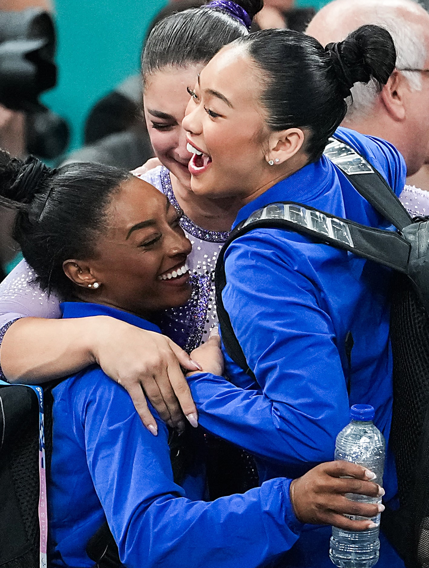 Simone Biles (left) and Suni Lee of the United States celebrate with Manila Esposito of...