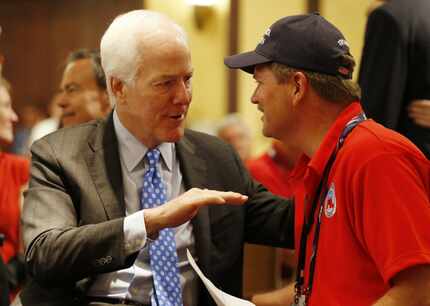 Sen John Cornyn talks with GOP party chairman Tom Mechler, at the Republican National...