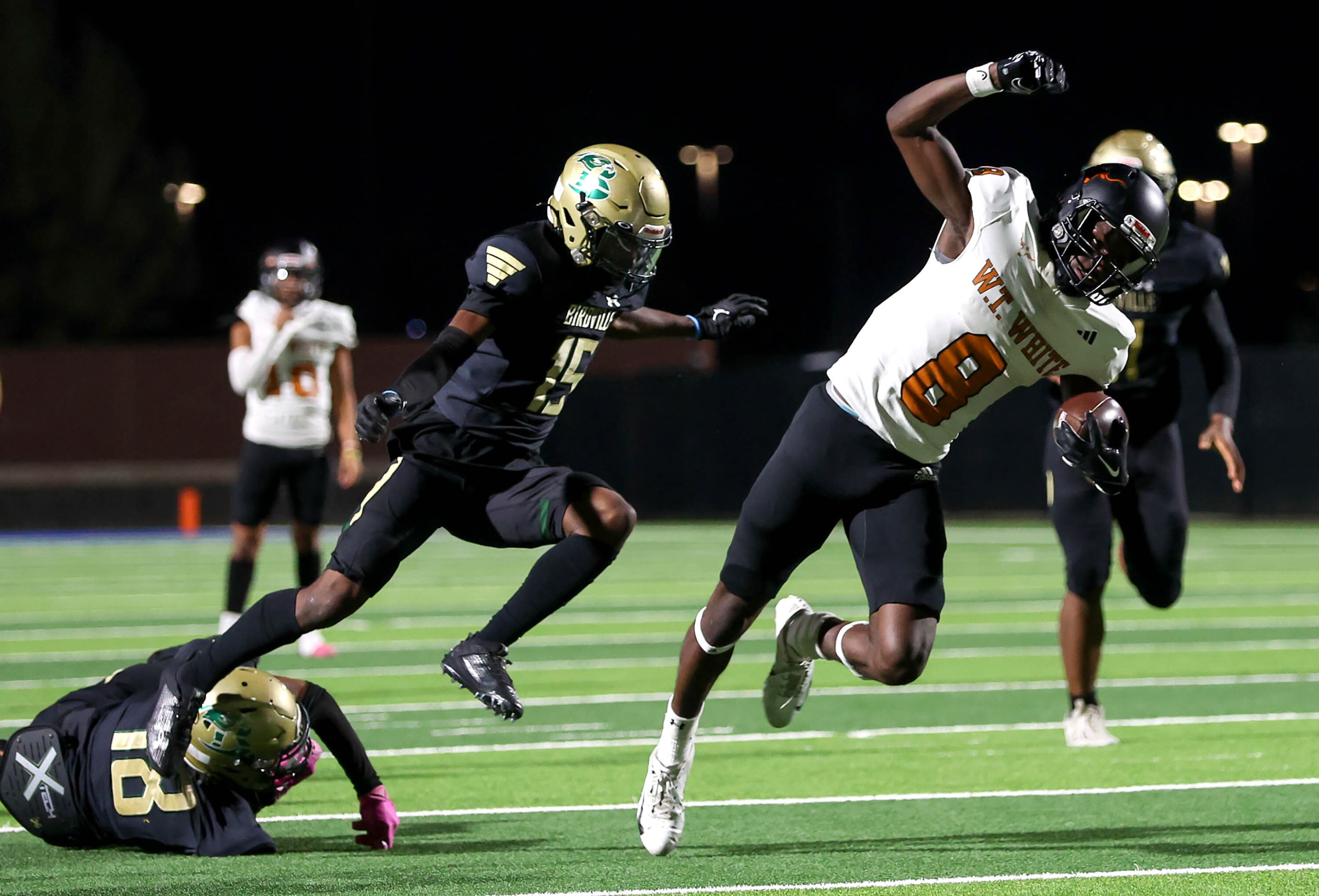 W.T. White wide receiver Demetrious Troupe (8) breaks free from Birdville defensive  James...