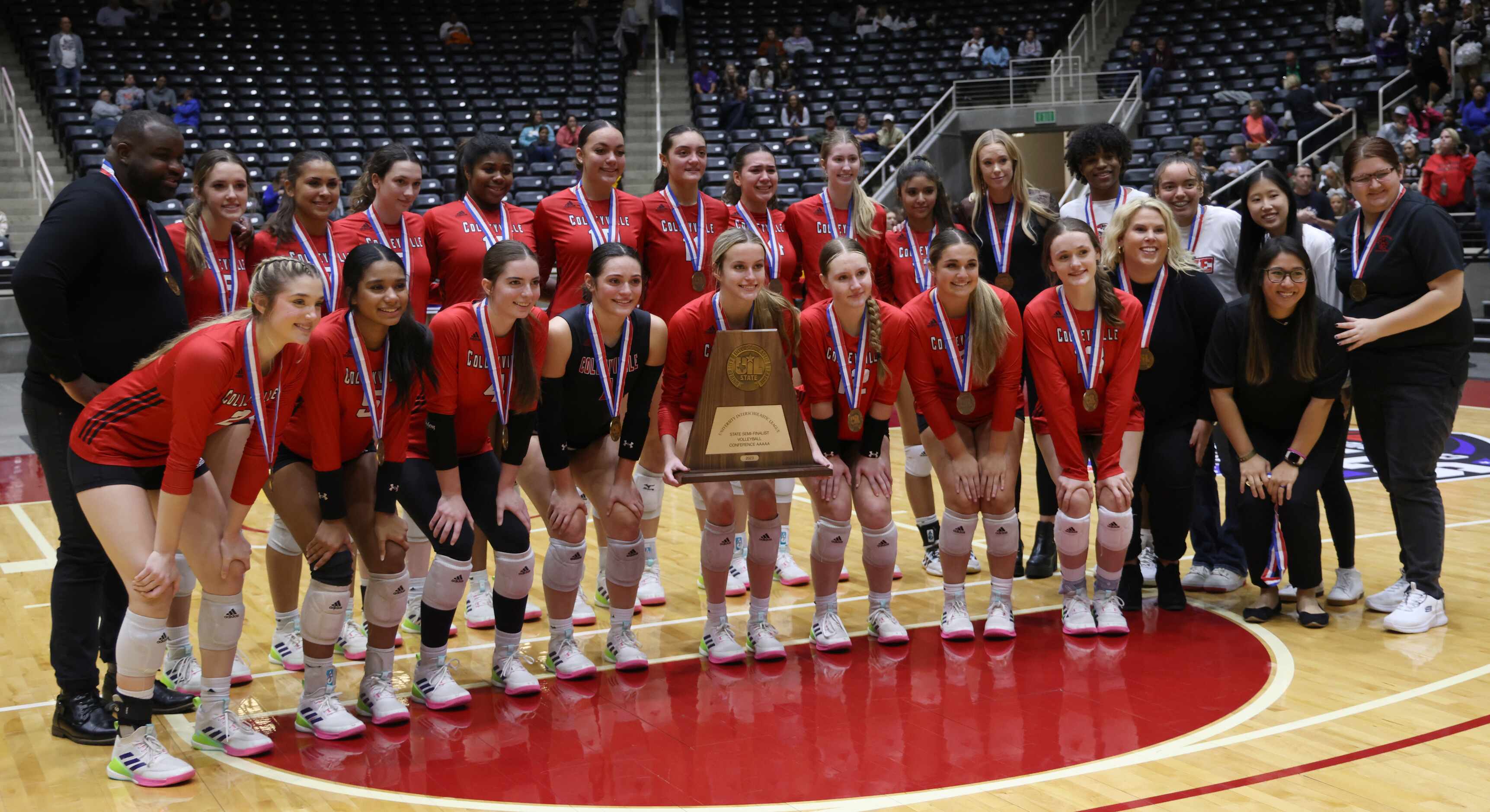 Colleyville Heritage players and coaches pose with their state semi-finalist trophy after...