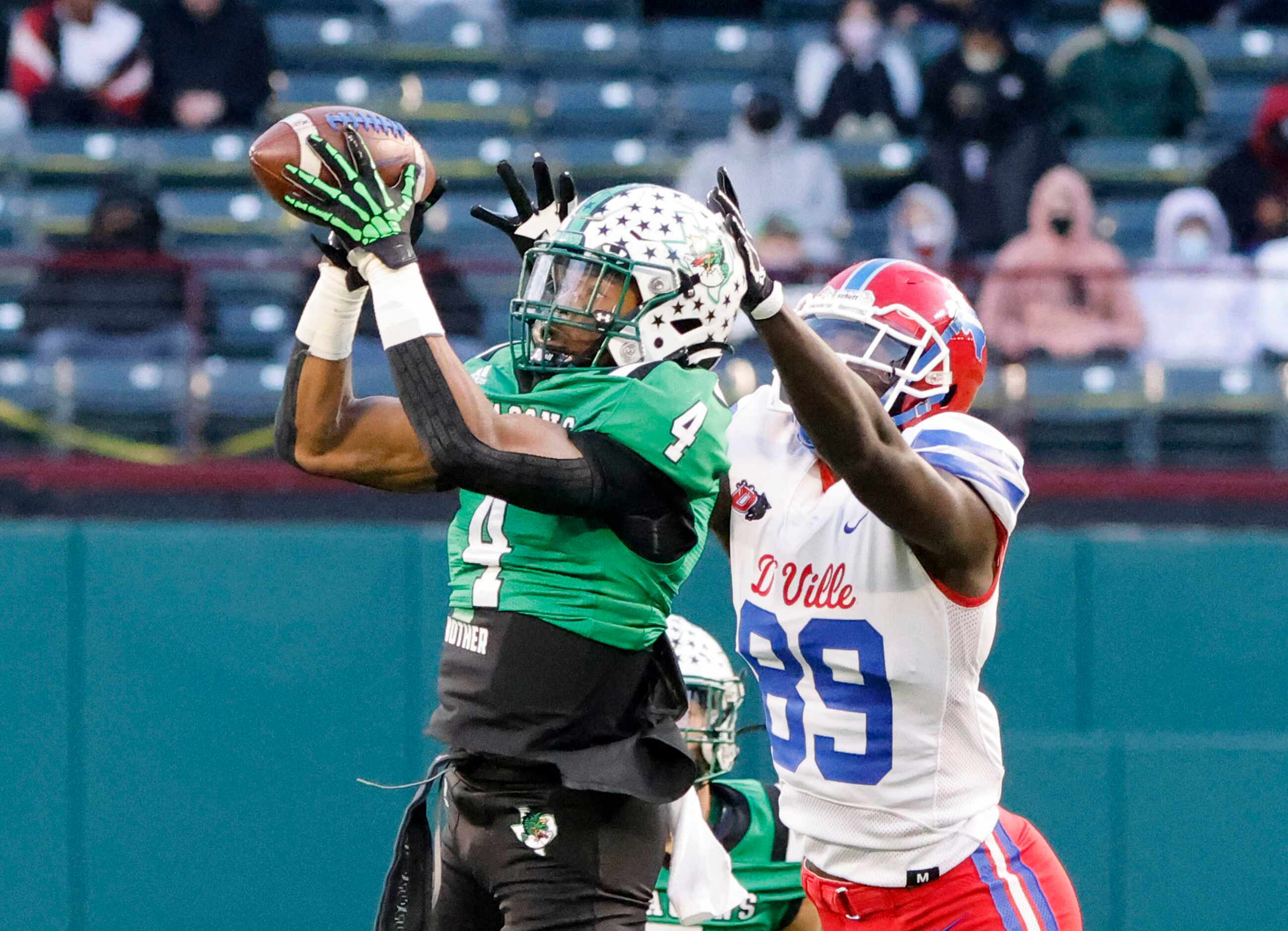 Southlake defender Cinque Williams (4) makes an interception on a pass intended for...