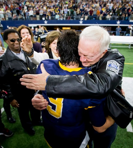 Highland Park quarterback John Stephen Jones (9) gets a hug from his grandfather, Dallas...