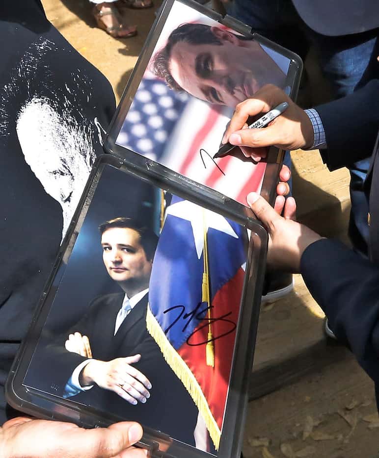 Sen. Ted Cruz signs autographs as he works the crowd while campaigning at the Katy Trail Ice...