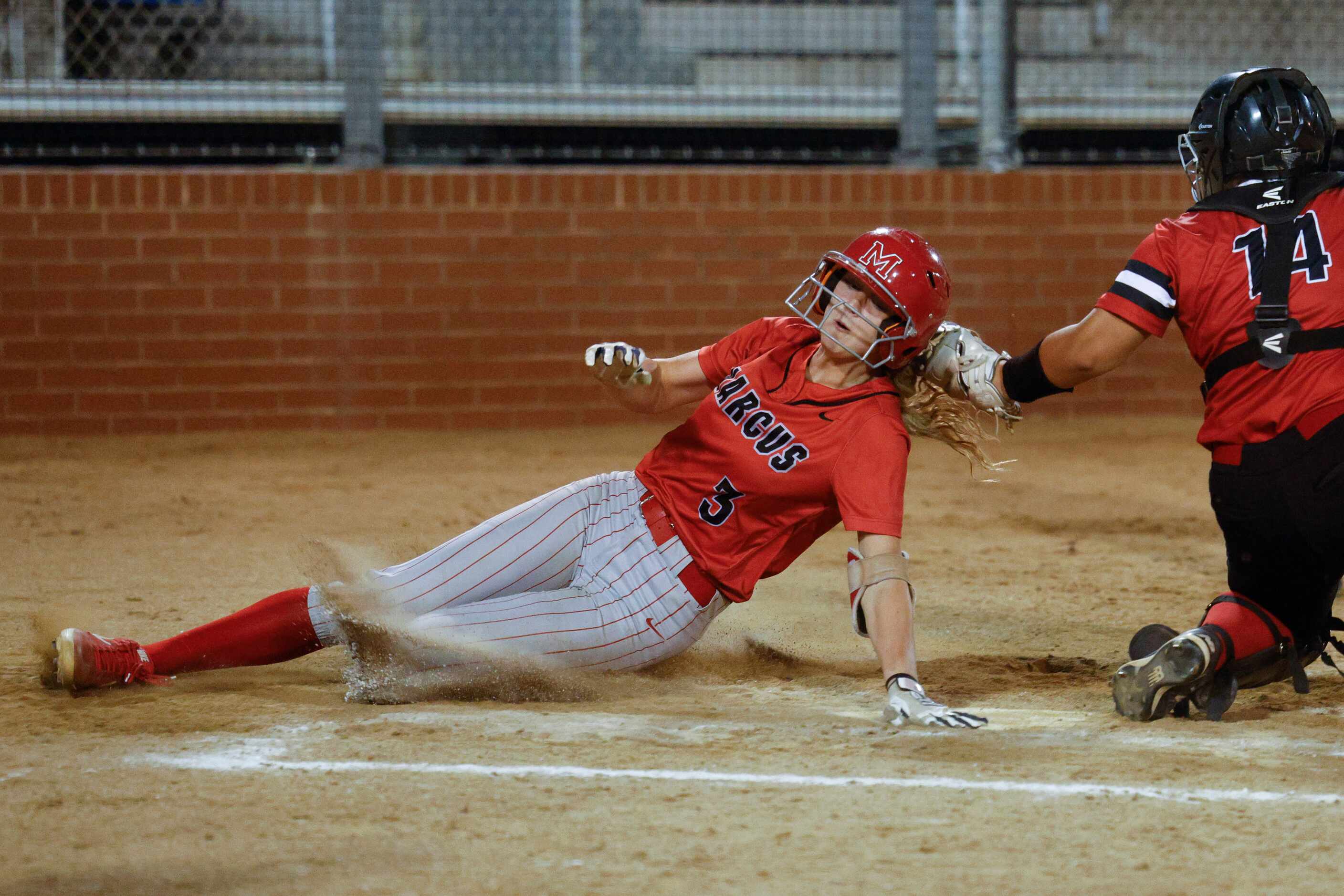 Photos: Sliding in style! Marcus Haidyn Sokoloski slides in safe at home  against Arlington Martin