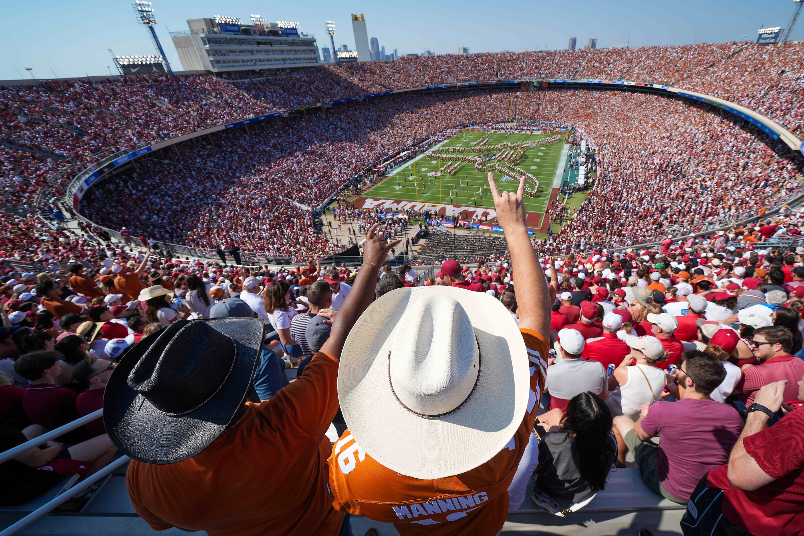 Texas fans cheer the Longhorns band before an NCAA college football game against Oklahoma at...