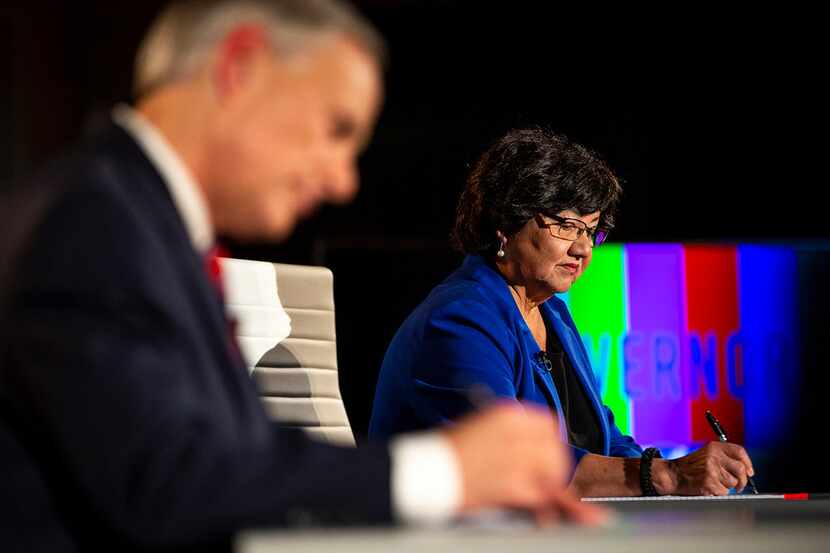 Lupe Valdez writes notes before her gubernatorial debate against Gov. Greg Abbott at the LBJ...