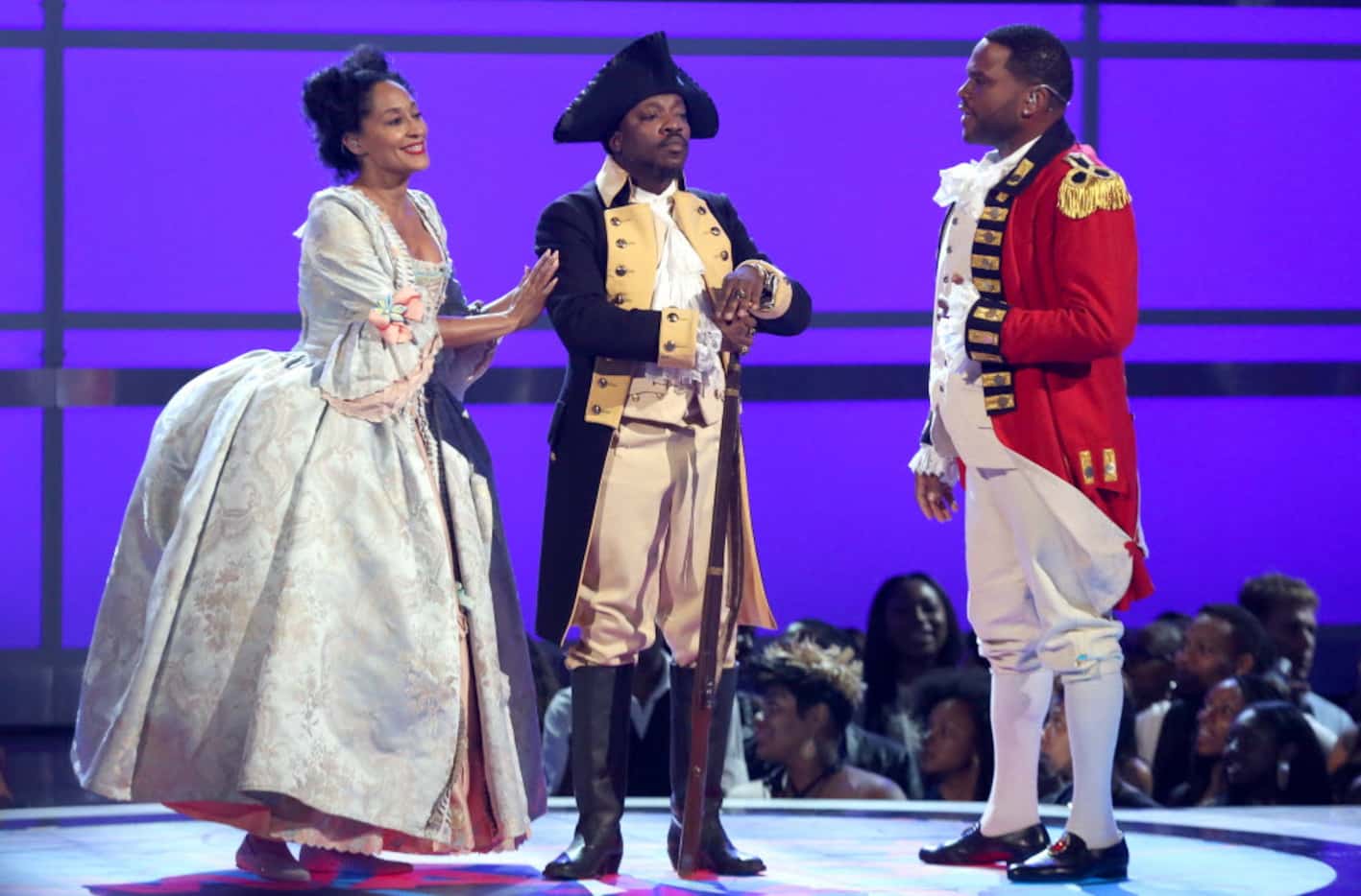 From left, Tracee Ellis Ross, Anthony Hamilton and Anthony Anderson perform a skit dressed...