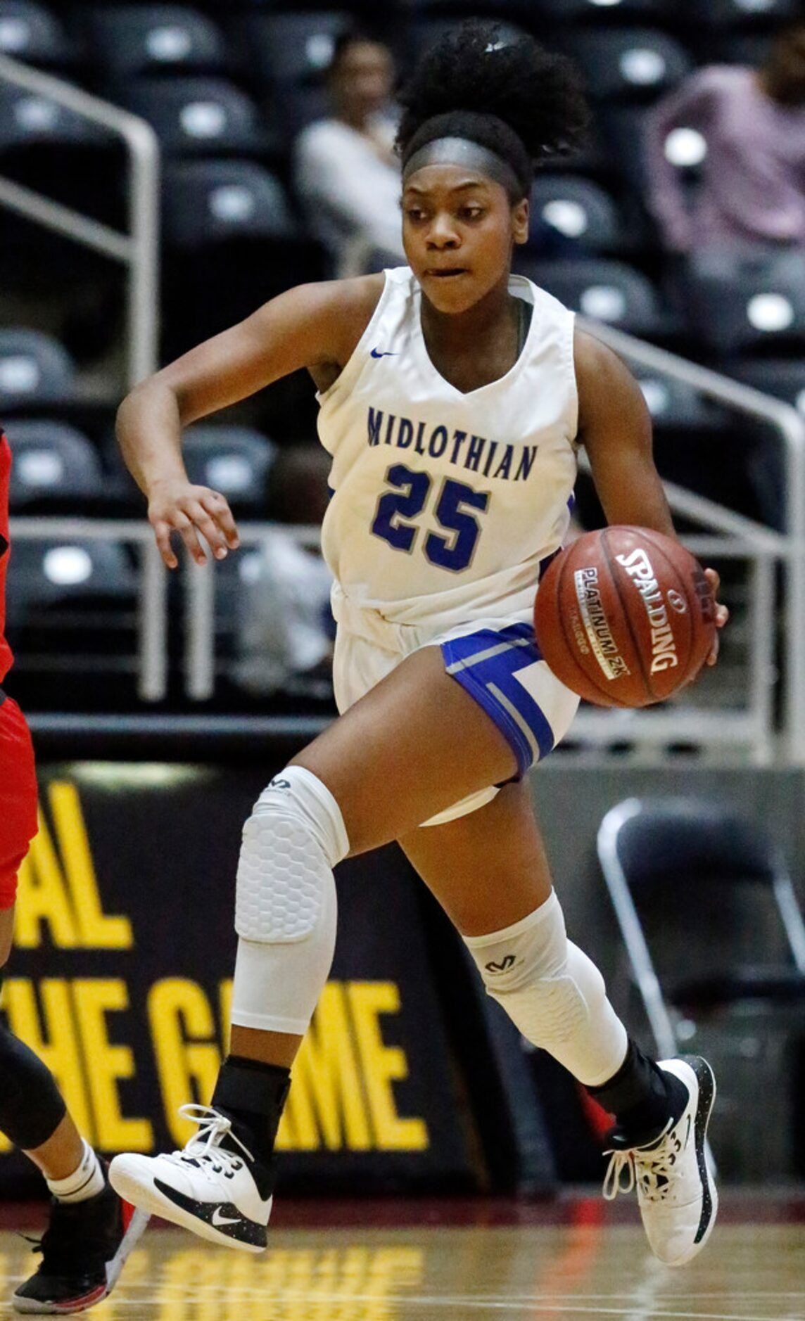 Midlothian High School guard Kadia Ward (25) leads a fast breakduring the second half as...