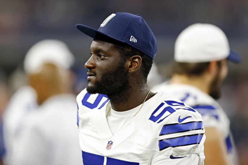 FILE - Dallas Cowboys middle linebacker Rolando McClain walks the sidelines during the...