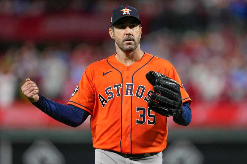 Houston Astros starting pitcher Justin Verlander celebrates the last out in the fifth inning...
