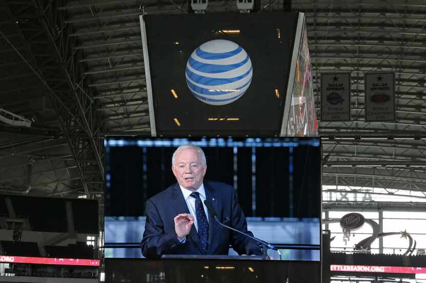 Cowboys owner Jerry Jones tis pictured on one of the giant video boards as he talks at the...
