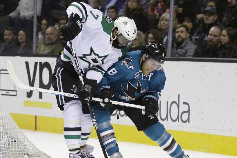 San Jose Sharks' Joe Pavelski (8) is defended by Dallas Stars' Johnny Oduya (47) during the...
