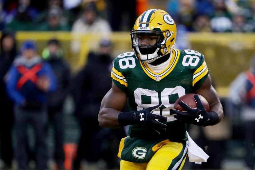 GREEN BAY, WI - JANUARY 8:  Ty Montgomery #88 of the Green Bay Packers runs with the ball in...