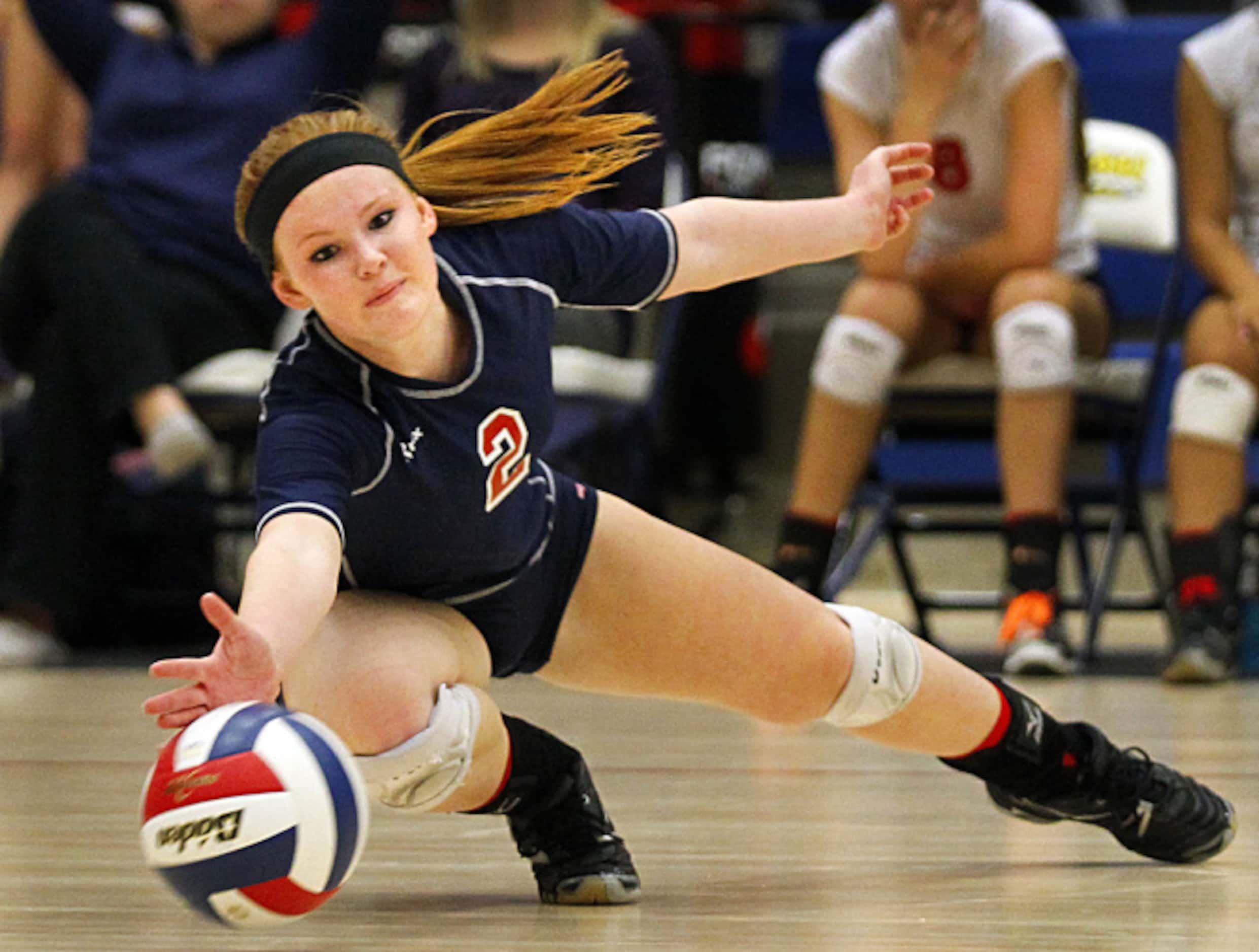 Frisco Centennial's Claire Berger tries to dig out a spike against Frisco High during their...