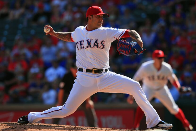 ARLINGTON, TX - APRIL 09:  Matt Bush #51 of the Texas Rangers throws against the Oakland...