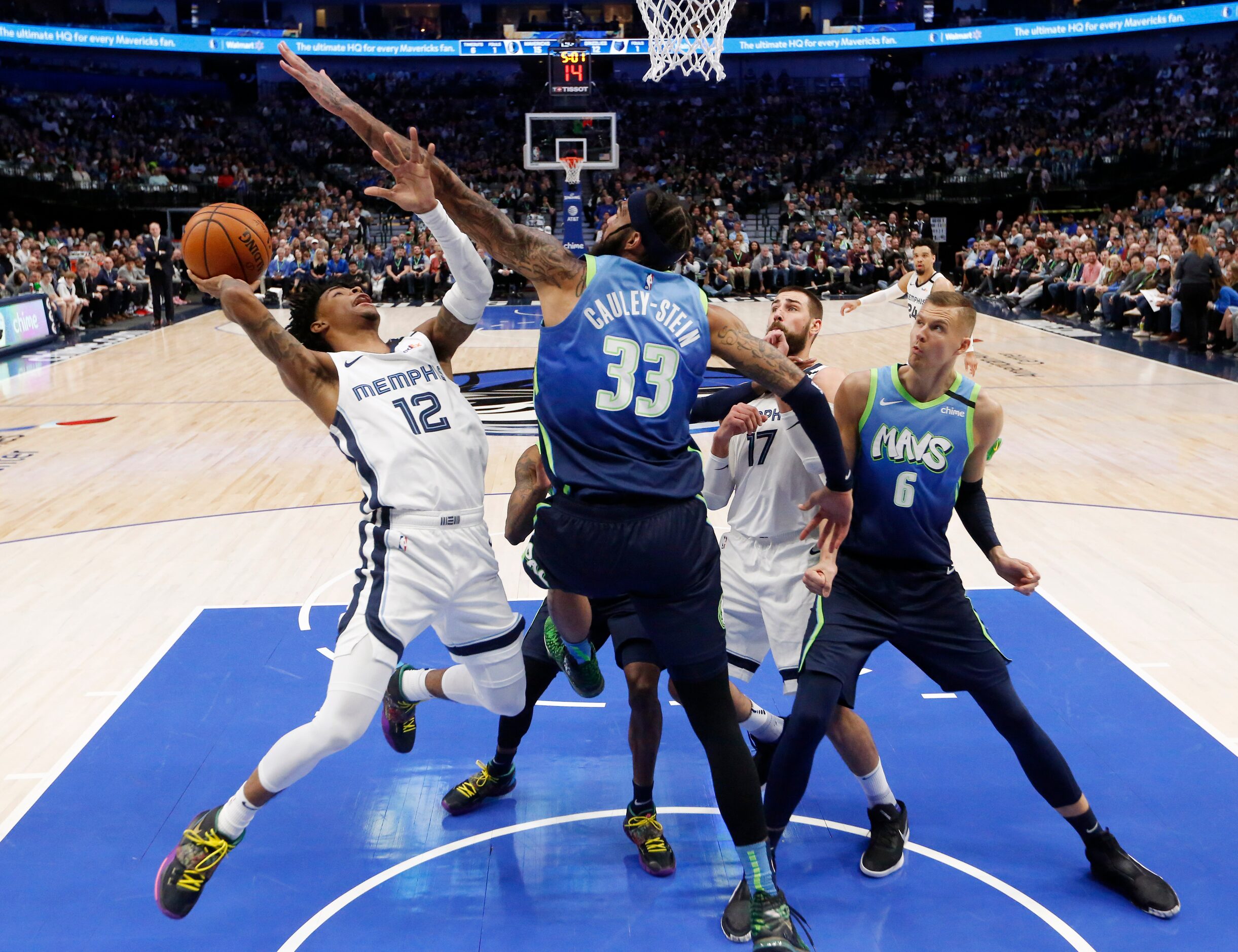 Dallas Mavericks center Willie Cauley-Stein (33) challenges a shot from Memphis Grizzlies...