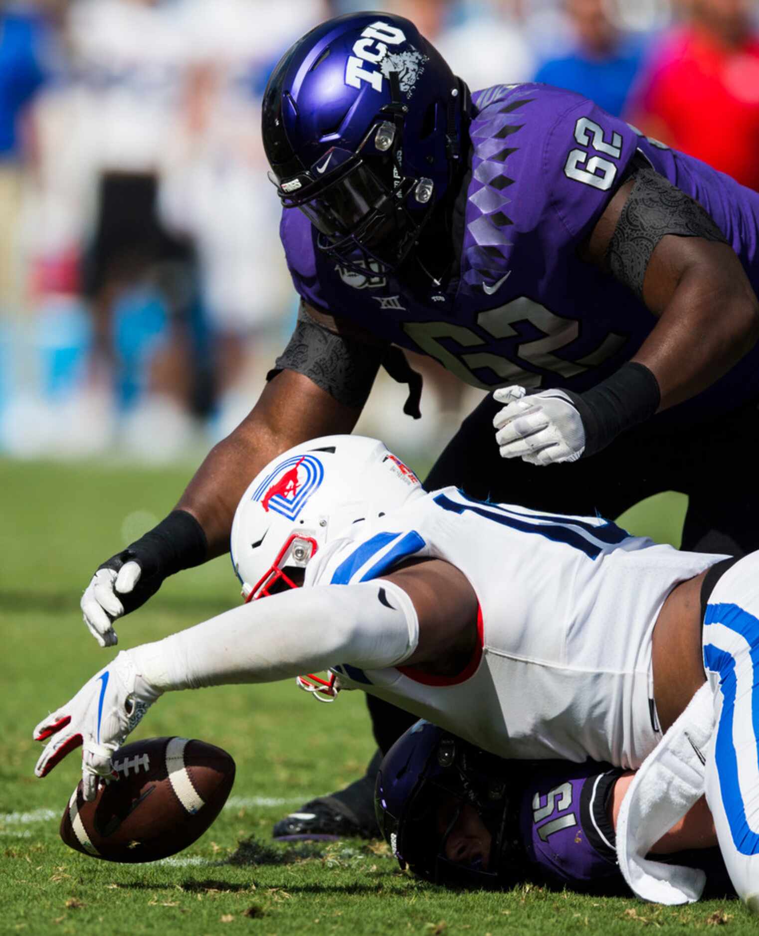 Southern Methodist Mustangs defensive tackle Demerick Gary (10) dives for a gal fumbled by...