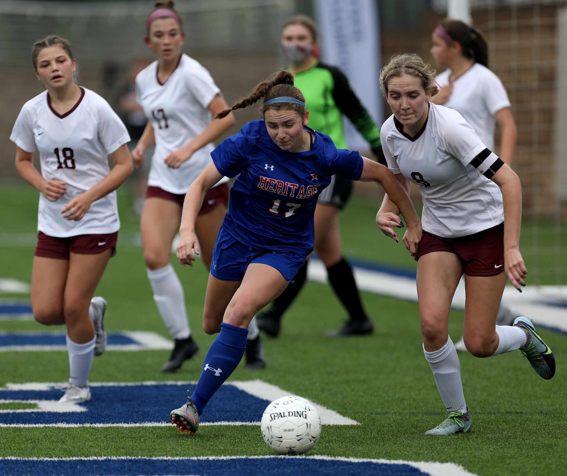 Midlothian Heritage's Kerry Scott (17) goes up against Calallen's Maddie Pearl (8) during...