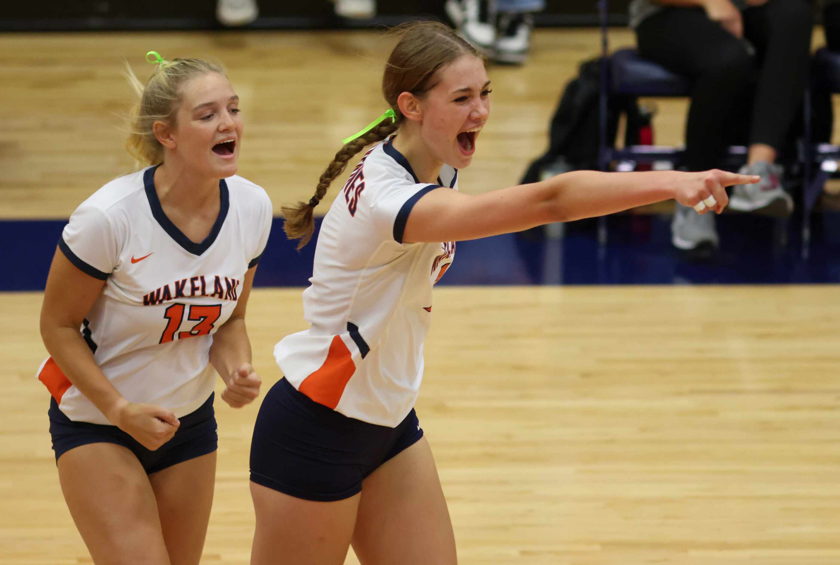 Frisco ISD’s Wakeland High School volleyball players Audrey Clark (13) and Jessica Jones (7)...