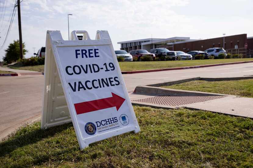 A sign announced a coronavirus vaccine clinic last month at Ann Richards Middle School in...