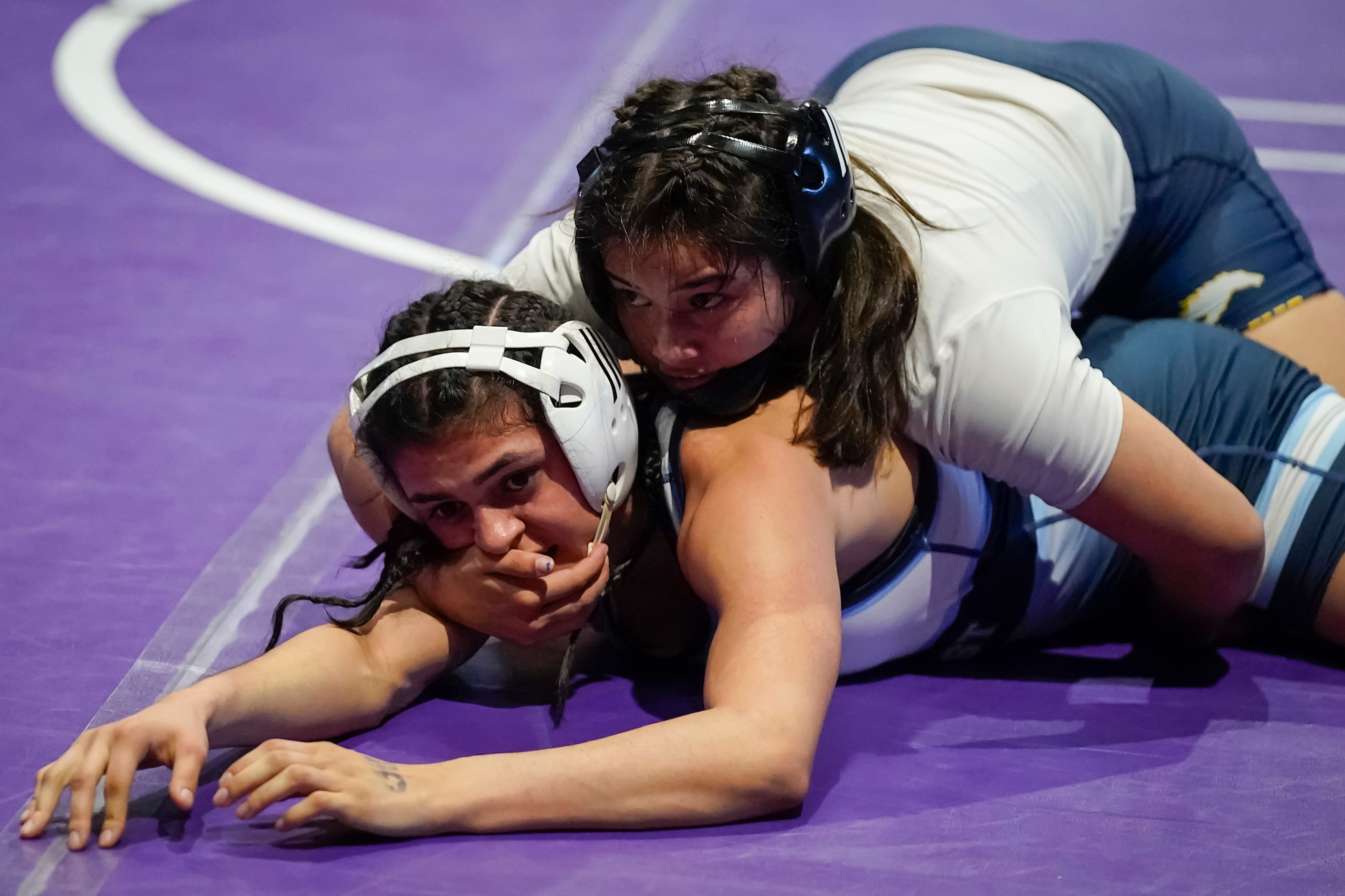 Devin Patton of Plano West (bottom) wrestles ayden Bazemore of Cypress Ranch for the 6A...