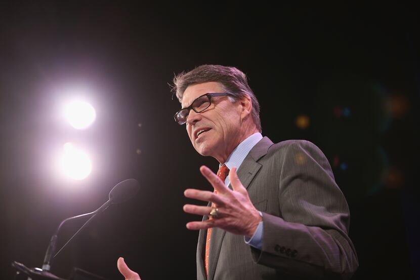 DES MOINES, IA - JANUARY 24:  Former Texas Governor Rick Perry speaks to guests at the Iowa...