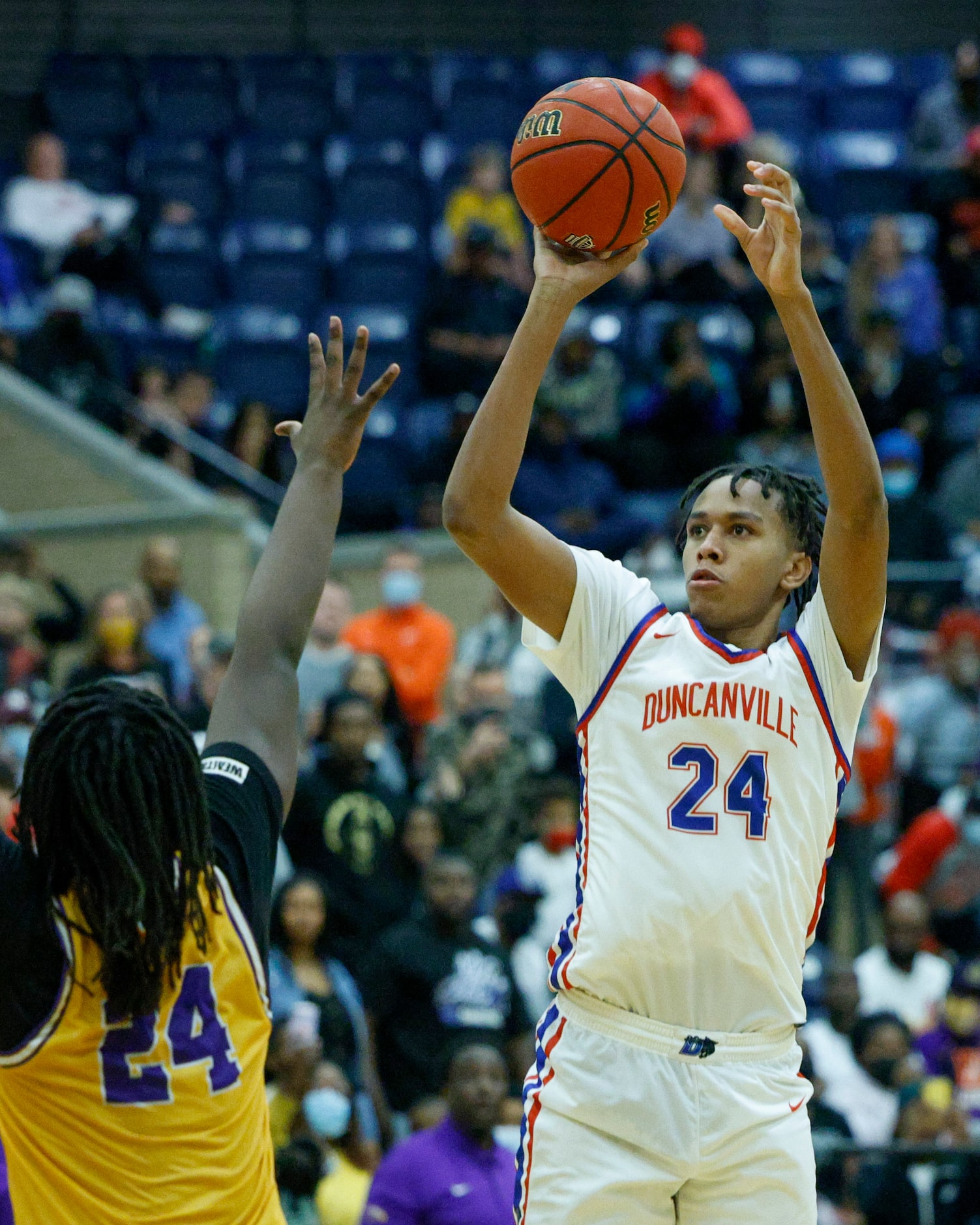 Duncanville forward Ashton Hardaway (24) elevates to shoot over Richardson forward Timmie...