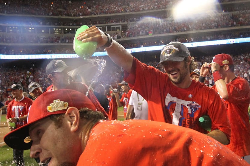 Former Ranger C.J. Wilson (right), shown here in 2010, made sure that Josh Hamilton, a...