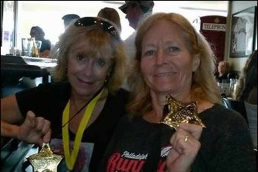 Nancy Cole and Linda Kelly with their star medals for completing five Rock 'n' Roll half...