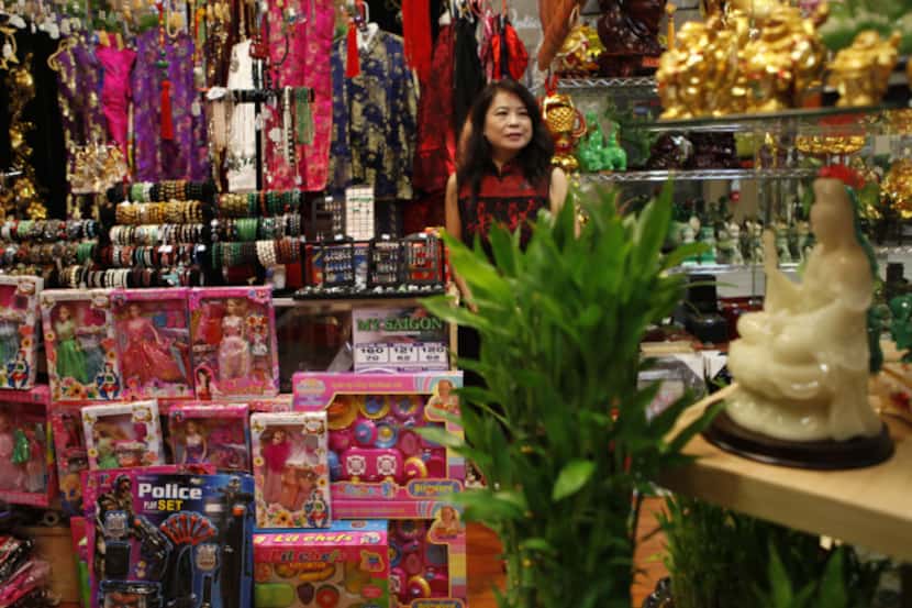 Yanna Liu looks after her store, Arts and Gift Collection, at the Cali Saigon Mall in...