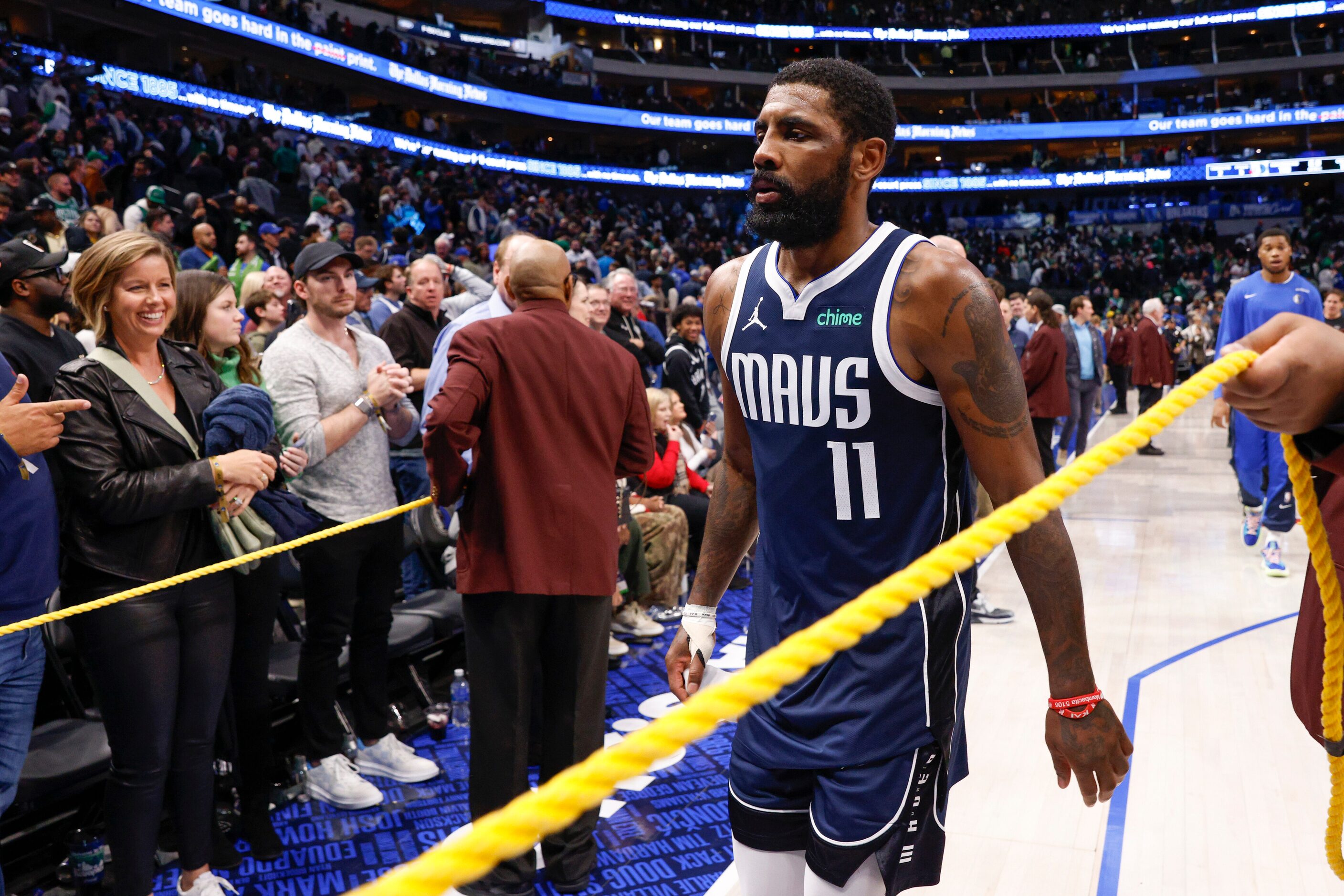 Dallas Mavericks guard Kyrie Irving (11) walks to the locker room after an NBA game against...