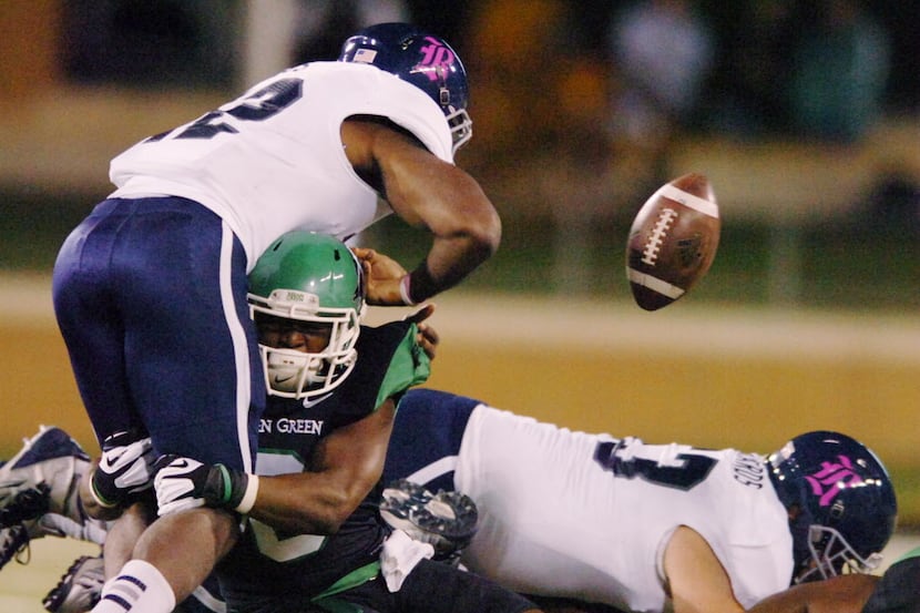 University of North Texas senior defensive back Marcus Trice (8) causes a fumble by Rice...