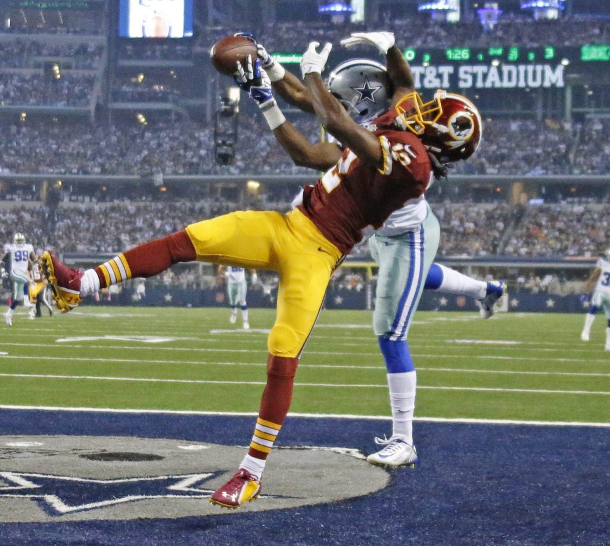 Dallas Cowboys strong safety J.J. Wilcox (27) intercepts a pass intended for Washington...