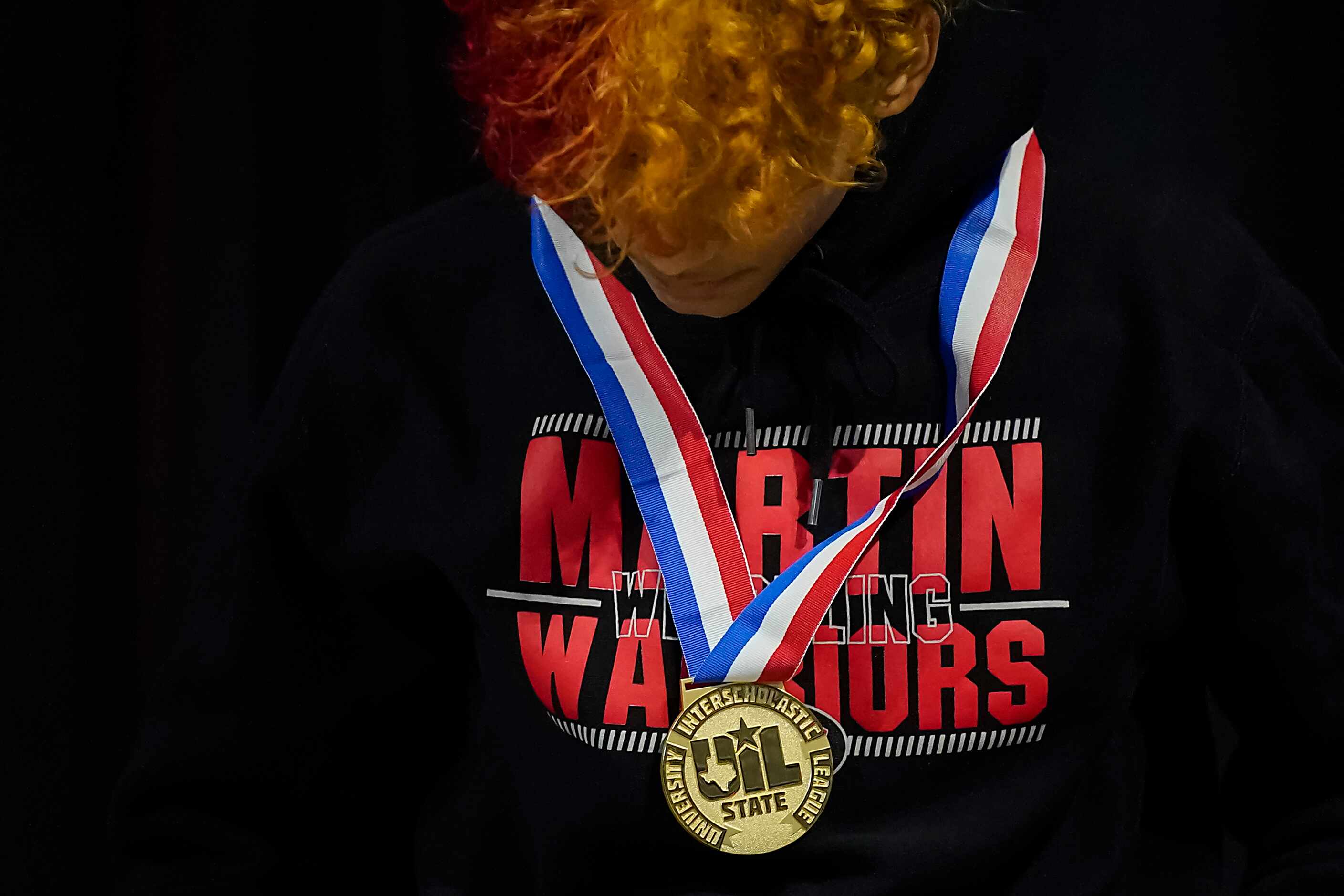 Shawn Ryncarz of Arlington Martin receives his medal after defeating Anthony Marino of...