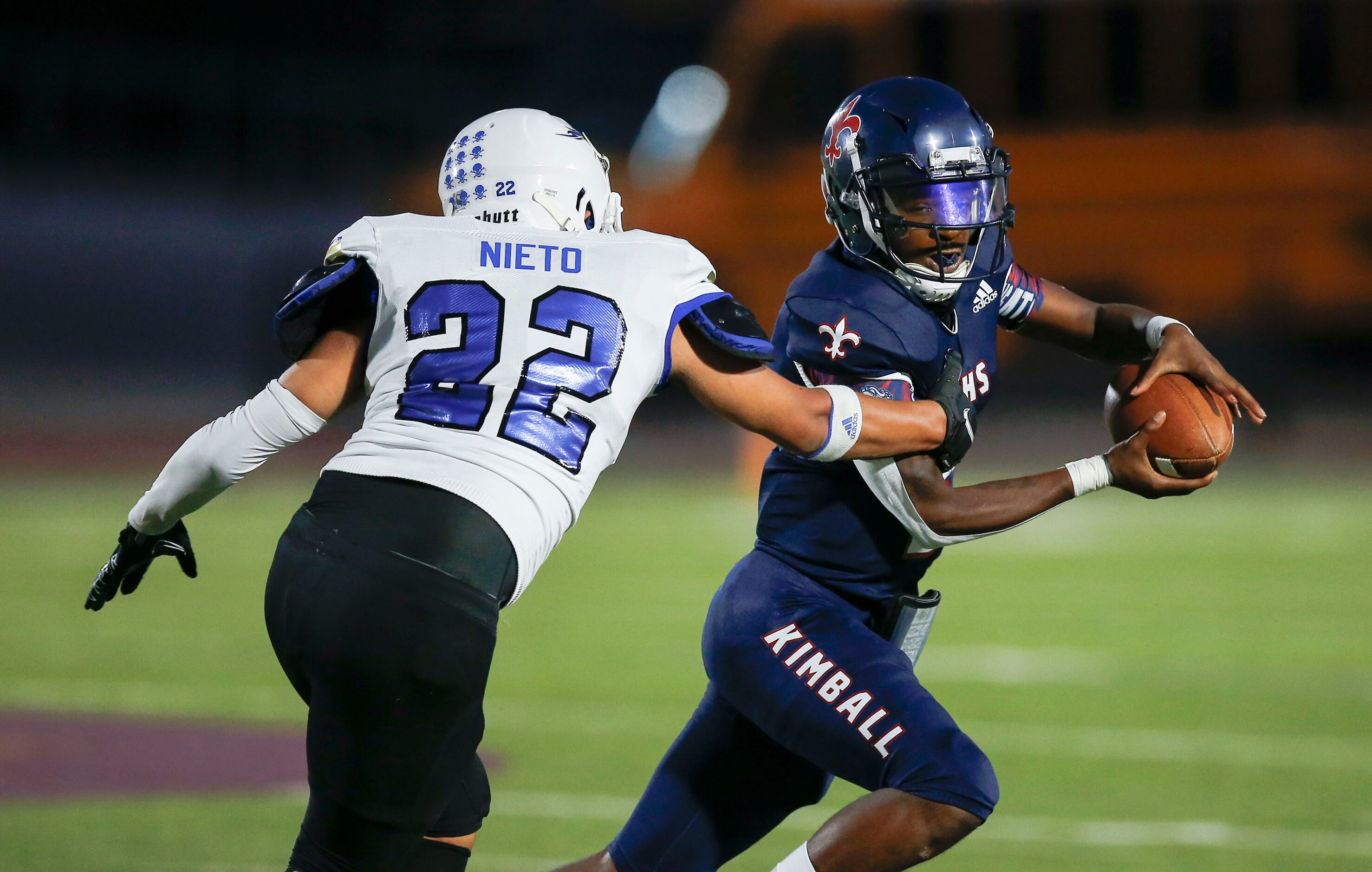 Conrad sophomore Brandon Nieto (22) tackles Kimball senior quarterback Jerqualan Parks...