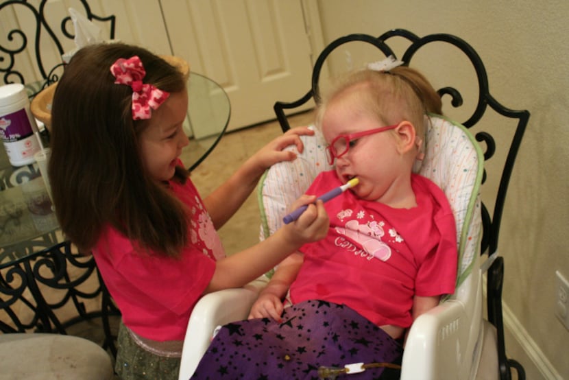 Lily helps “wake up” Harper’s mouth with a vibrating tool that helps stimulate her muscles.
