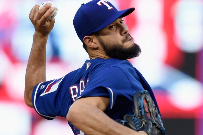 MINNEAPOLIS, MN - AUGUST 04: Martin Perez #33 of the Texas Rangers delivers a pitch against...
