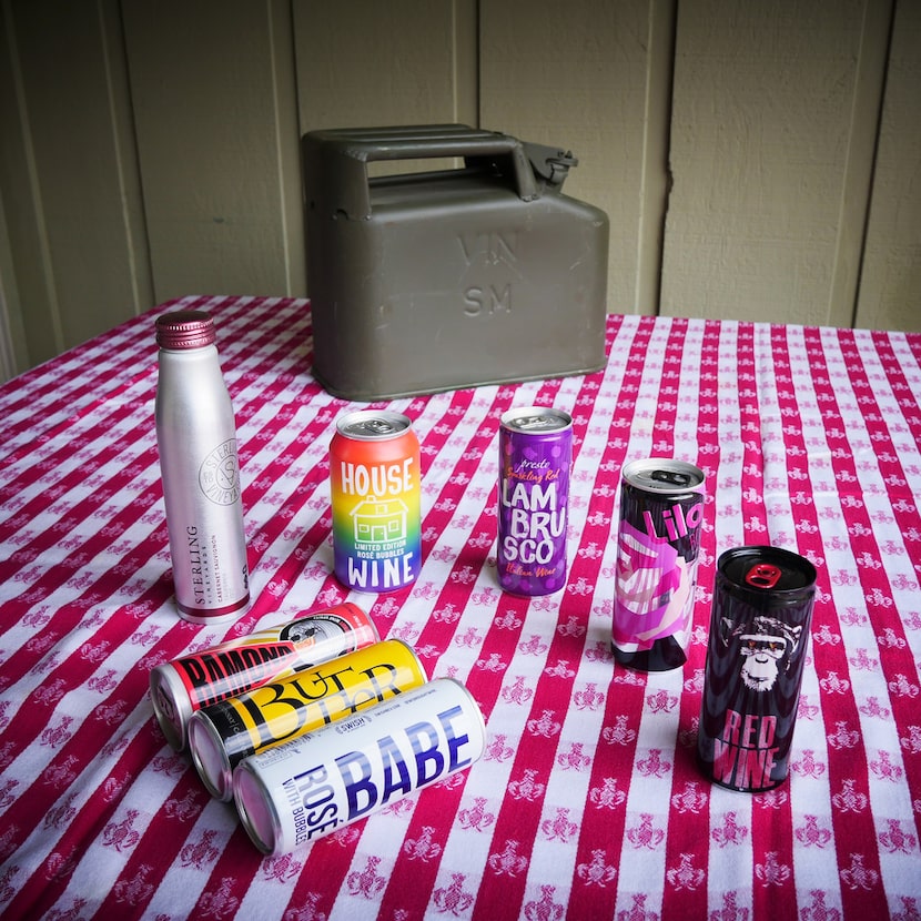 Various canned wines are pictured with a vintage French army wine can.