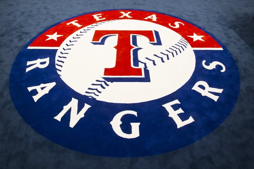 The team logo fills the center of the room in the clubhouse of the Texas Rangers newly...