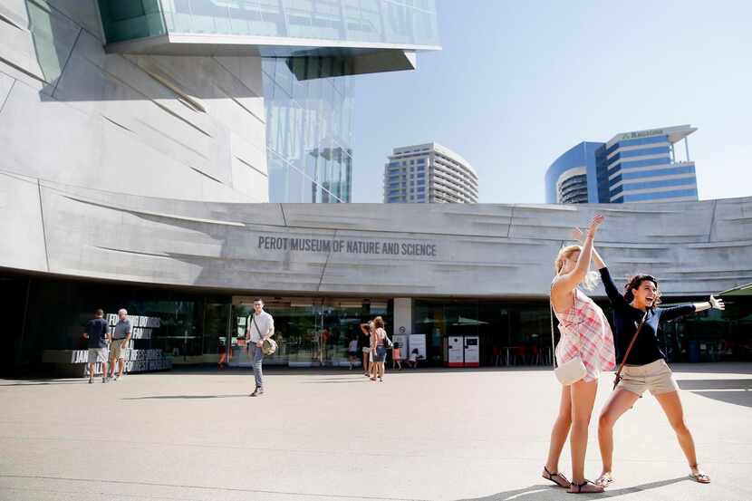 Visitors posed  for a photo in the plaza during a recent Discovery Days event at the Perot...