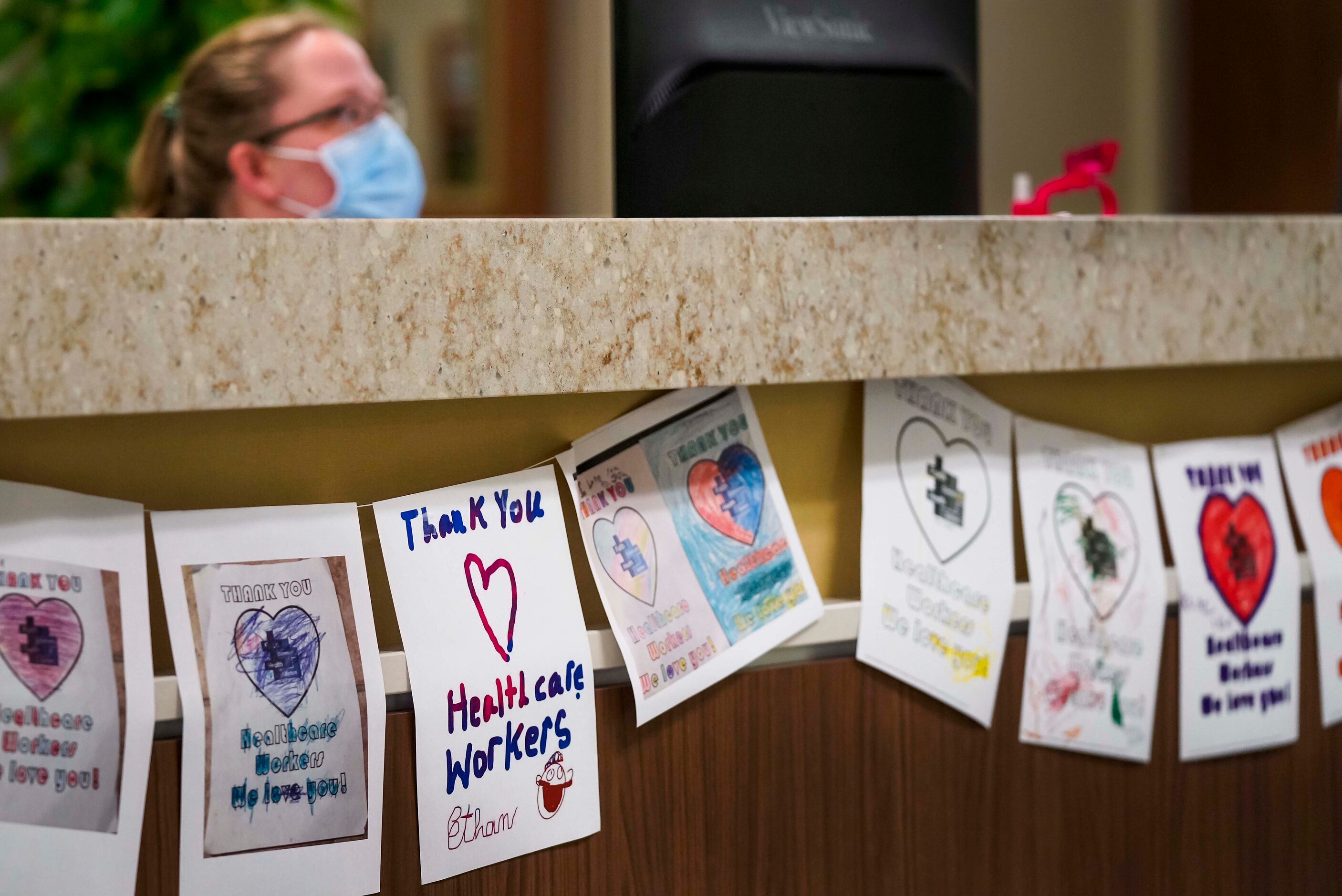 Thank you notes from area school children line a nurses station in the maternity ward at...