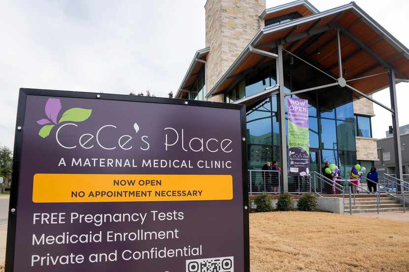 People gather for a ribbon cutting ceremony at CeCe’s Place, a new maternal medical clinic,...