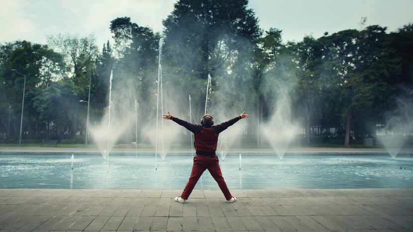 A man dancing in front of a fountain in TurboTax's Super Bowl spot. 