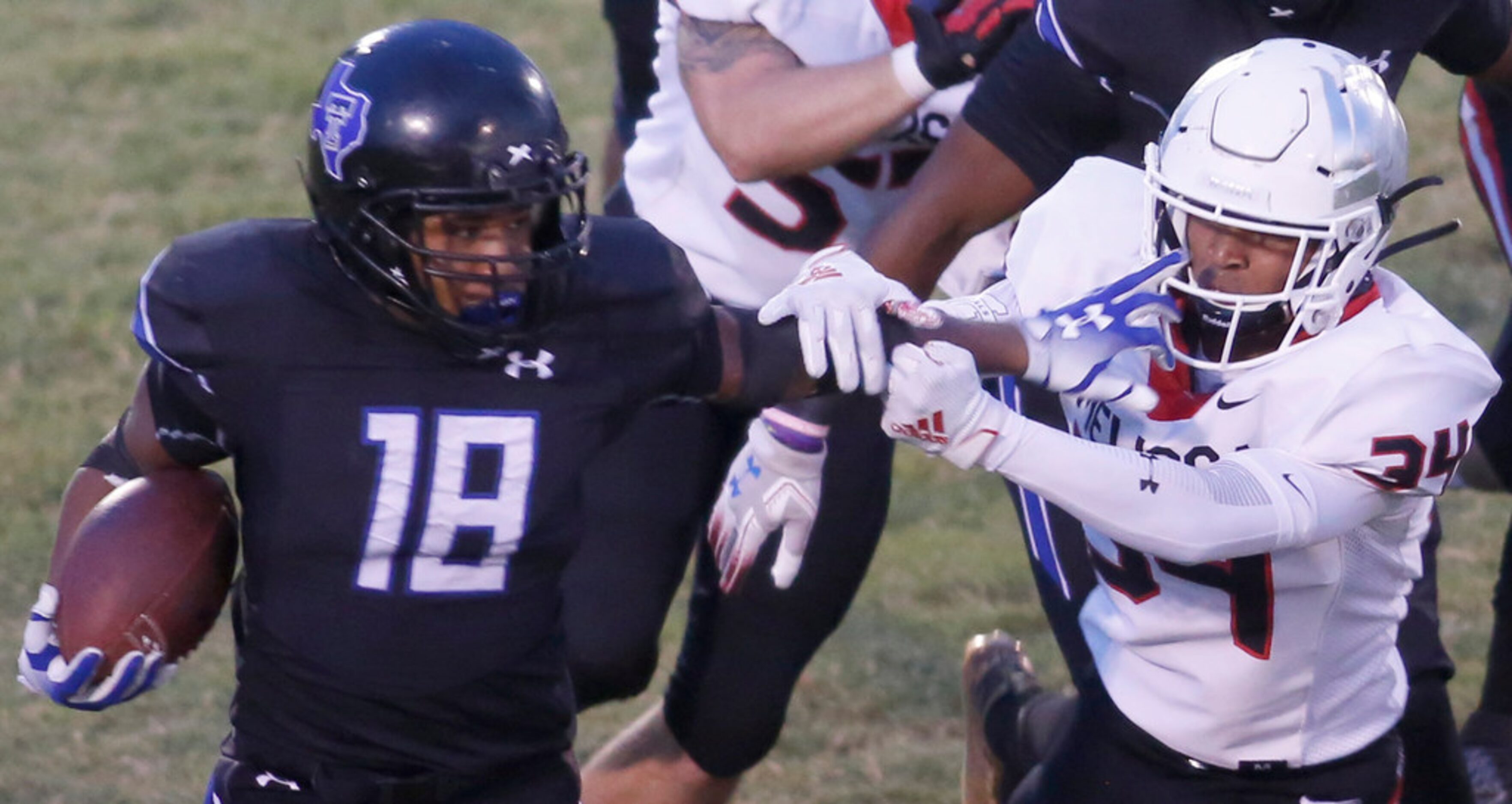 Trinity Christian Cedar Hill running back Emari Matthews (18) stiff-arms Melissa linebacker...