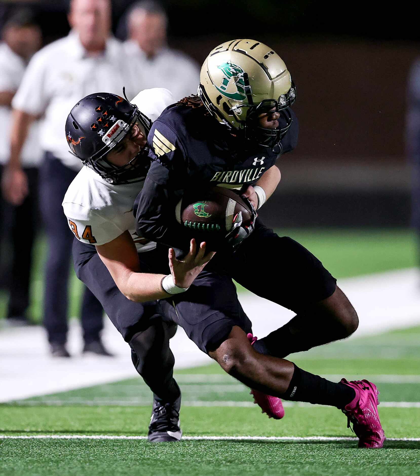 Birdville wide receiver Decorian Patton (right) comes up with a reception against W.T. White...