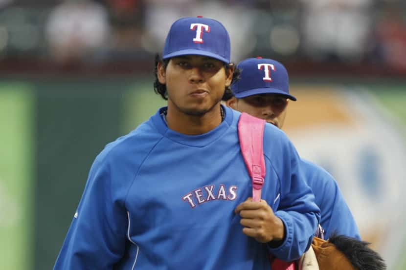Texas Rangers relief pitcher Wilmer Font walks from the dugout after the Texas Rangers...