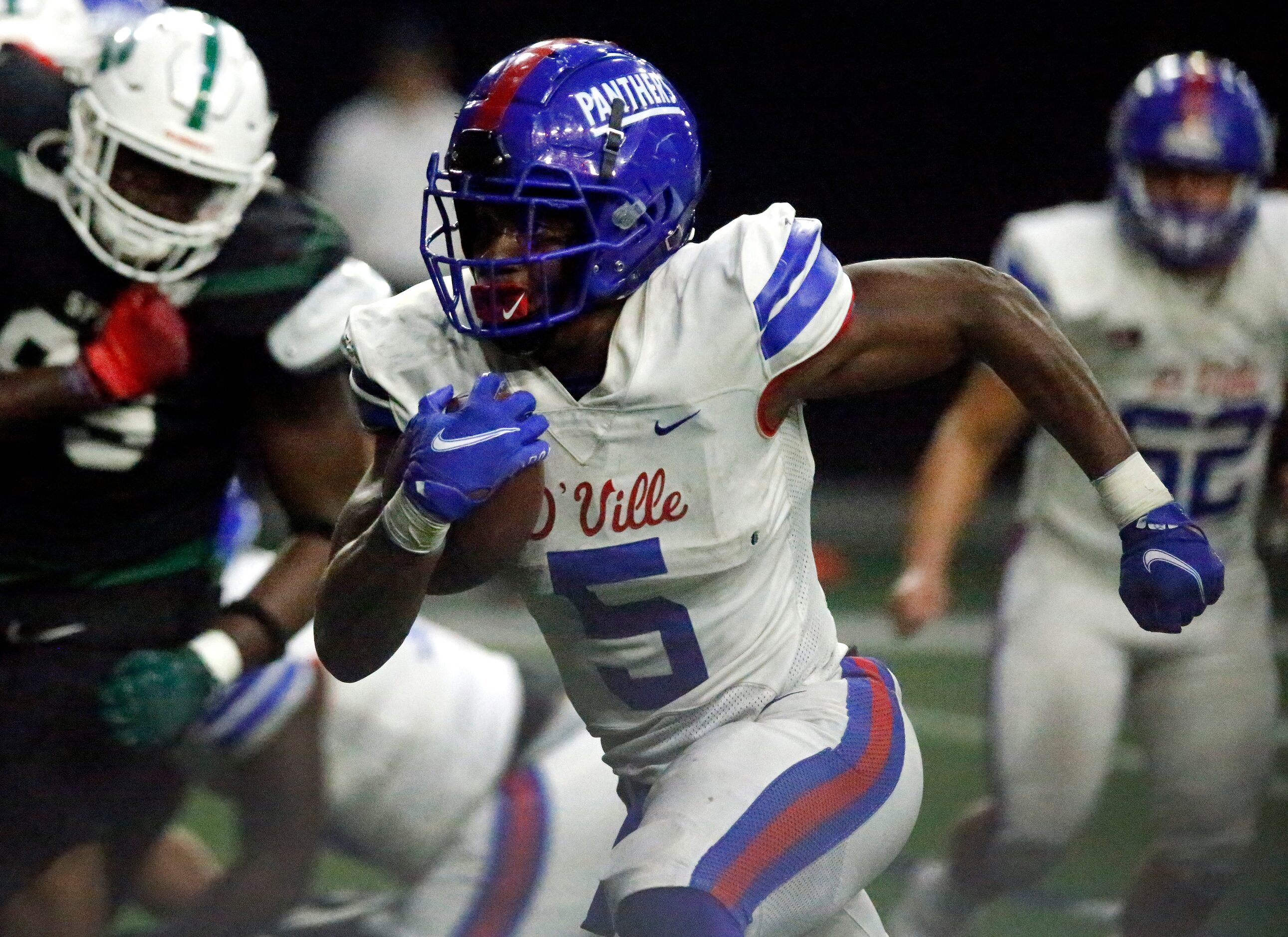 Duncanville High School running back Malachi Medlock (5) scores a touchdown during the first...