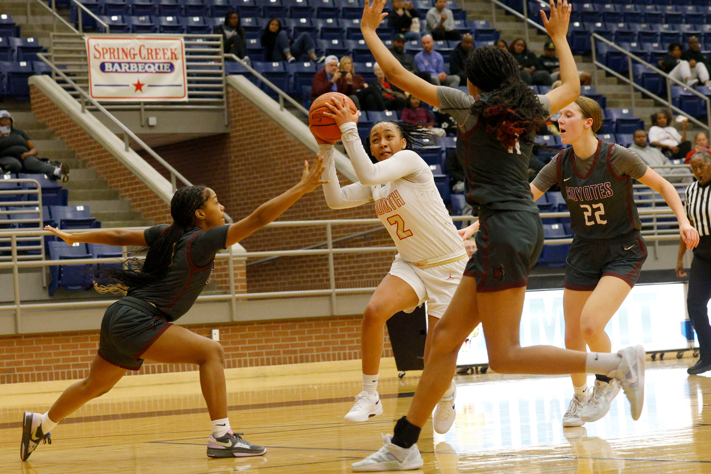 South Grand Prairie's Payton Garrett (2) keeps the ball away from Frisco Heritage's Aniya...