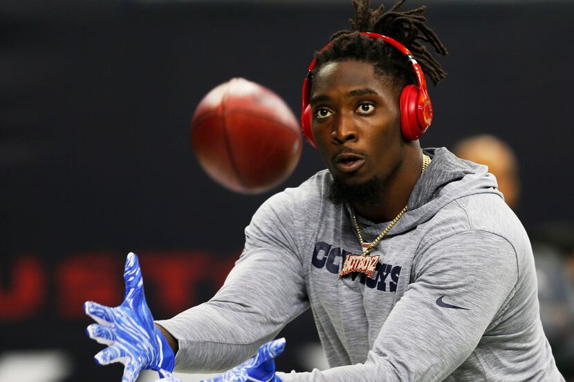 Dallas Cowboys defensive end Demarcus Lawrence (90) prepares to catch a ball prior to a game...
