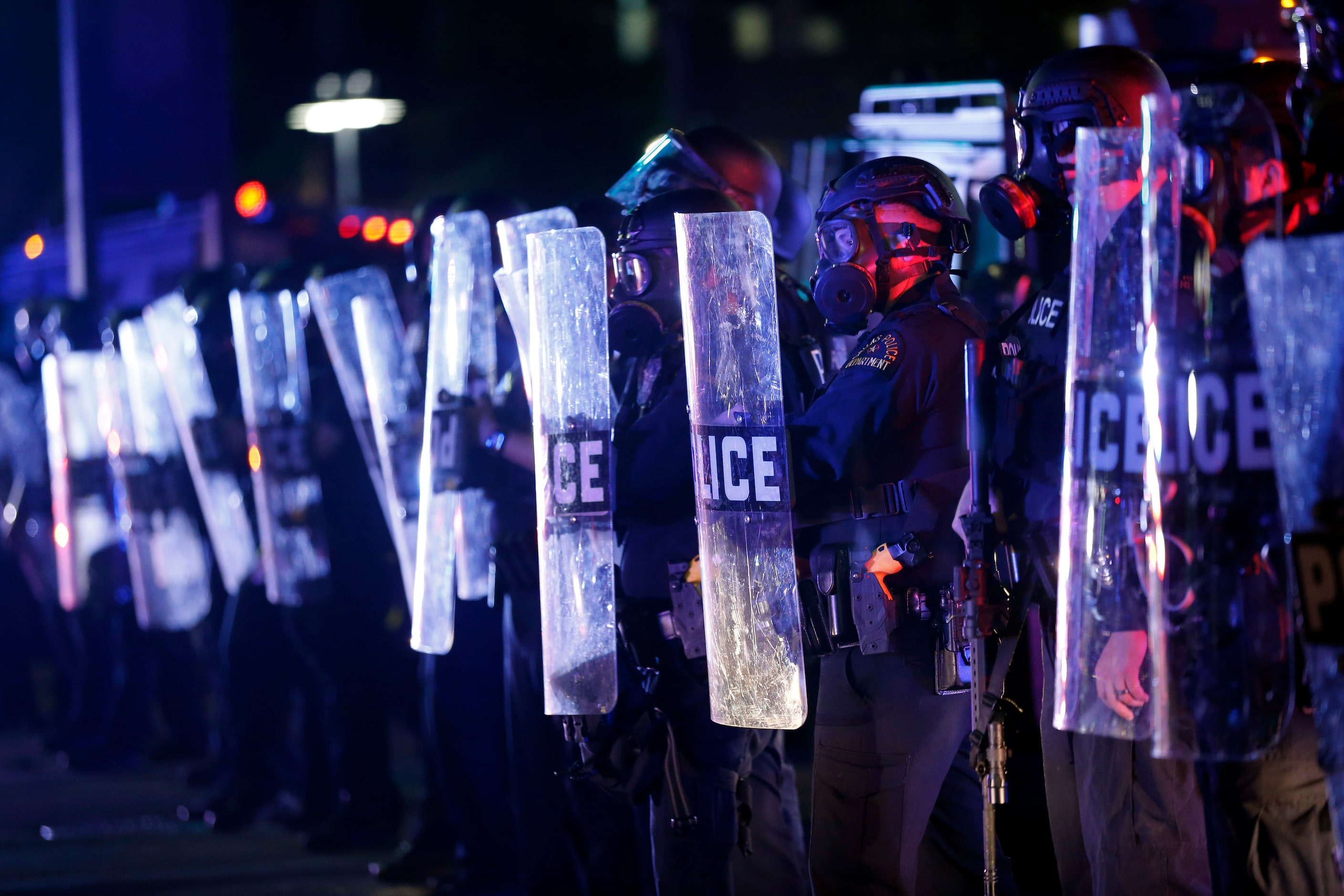 Dallas Police tactical officers form a stronghold  at the intersection of Young St. and S....